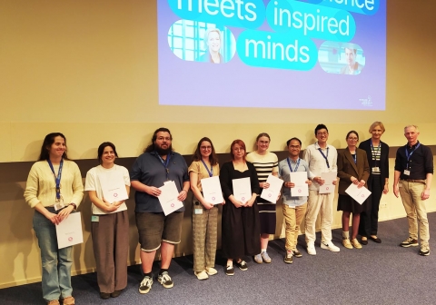 Participants of the EU-LIFE Connects Science 2026 programme receiving their certificate of participation from Marta Miączyńska, Chair of EU-LIFE, and Henri van Luenen, Director of operations NKI.